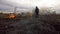Man standing on a burning field in the steppe