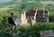 Man standing before cliffs