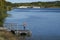 Man standing on the deck and fishing at Black Hoof Park Dam in Lenexa, Kansas