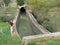 Man standing on edge of Concrete aquaduct irregation canal