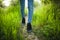 The man is standing in the grass. Vibrant background of lush blades of green grass