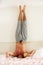 Man Standing On Head Eating Breakfast In Bed