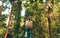 A man standing among jungle there is big tall tree with backpack Travel Lifestyle wanderlust adventure concept summer vacations