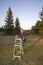 Man Standing With Ladder