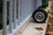 Man standing near the fence on the black hoverboard