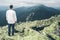 Man standing on the peak of the carpathian mountains