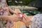 man standing on a pier at the knee makes a marriage proposal