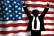 Man standing raising his arms in victory in front of big waving American flag. Presidential election concept showing the winner in