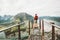 Man standing on Rampestreken viewpoint over mountains