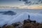 Man standing on a rock at the Lantau Peak