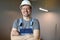 Man in standing room wearing protective helmet