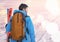 man standing with skies in snow