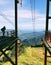 A man standing on the top of Cannon Mountain