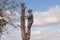 Man standing on tree