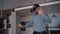 Man is standing and using smart digital vr technology gadget by gesture interaction motion.