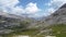 Man standing on a vast mountain plateau in the Dolomite Alps