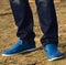 Man is standing wearing jeans and shoe photograph