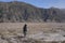 A man stands alone in the Mount Bromo caldera