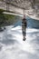 A man stands on his head on a bench inverted photo