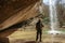 Man stands near Kozyrek waterfall in Crimea