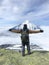 Man stands on the top of Avachinsky volcano in Kamchatka krai, Russia