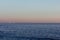 Man on standup padddle with cruise ship in the background, captured in Cascais, Portugal