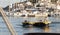 Man steering a fishing boats on summer day in the harbour