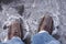 Man steps on frozen puddle with thin ice