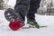 A man steps on a red rose lying in the snow due to separation from his beloved