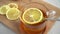 A man stirs tea with lemon and puts a spoon next to it. Immunity Recovery Drink