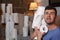 Man stocking up toilet paper at home