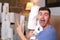 Man stocking up toilet paper at home