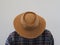 A man in a straw hat bowed his head to not see his face