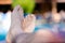 Man stretched legs at swimming pool with clear turquoise water