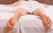 Man stretching in bed. Cheerful young man is waking up after sleeping in the morning. Sleep wake up.