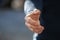 Man stretching hand for handshake outdoors, closeup