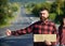 Man with strict face and beard travelling by hitchhiking