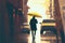 A man strolling through a rainy urban alley with a radiant yellow parasol