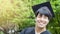 Man student smiles and feel happy in graduation gowns and cap