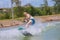 Man study wakeboarding on a blue lake