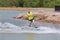 Man study wakeboarding on a blue lake