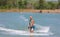 Man study wakeboarding on a blue lake