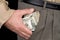 Man stuffing wads of cash into his pocket