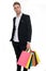 Man stylist professional shopper. Shop consultant helps carries bunch shopping bags. Clothes consultant. Stylist buy