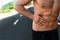 Man Suffering From Stomach Pain After Running Outdoors. Sport Injury