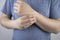 A man suffers from elbow pain. Damaged elbow joint, bone fracture, or sprain. Hand injury and flexion pain concept