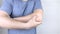 A man suffers from elbow pain. Damaged elbow joint, bone fracture, or sprain. Hand injury and flexion pain concept