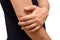 A man suffers from pain in elbow, holds his hand to the elbow, isolated. Healthcare concept, sports injury