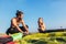 Man sufrers with his son in wetsuits with kite equipment for surfing