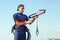 Man sufrers in wetsuits with kite equipment